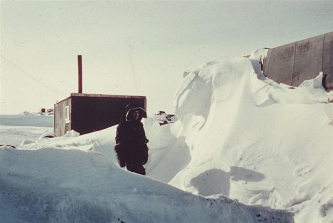 Snow drift at a hut in the construction camp. April 1953.