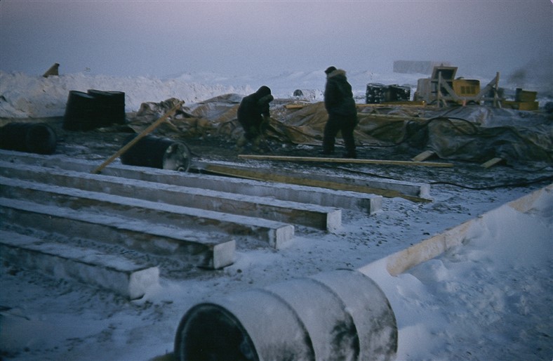 Laying the foundation sills for the module train. Nov 1955.