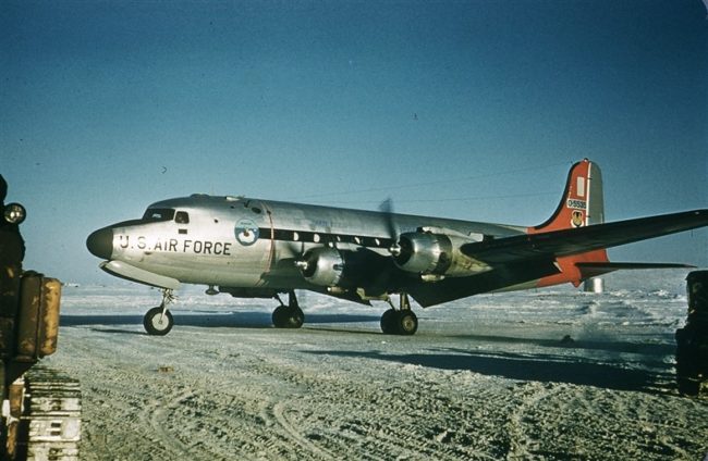 Visiting military people on the USAF, DEWZIAK, DC-4 aircraft in May 1957.