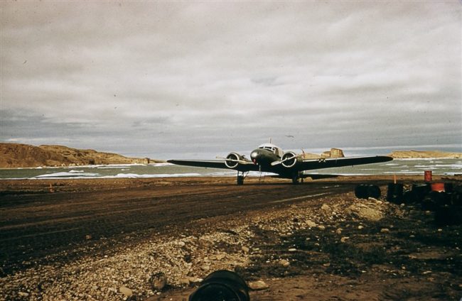 An Anson aircraft parked at the end of the airstrip. Aug 1956.