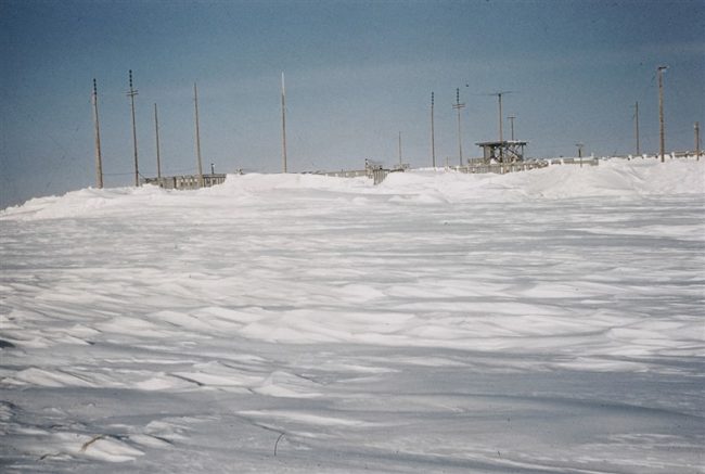 Snow buried modules showing the radome platform awaiting the radar antennas and radome. March 1956.