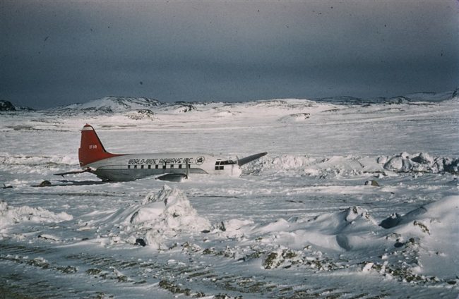 Hazards of Arctic flying. C-46, CF-IHR, overran the runway on Sept 23rd, 1956. No injuries. May 1957.